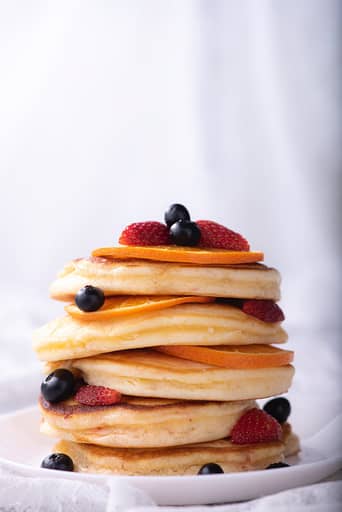 stack of pancakes with strawberry fruits