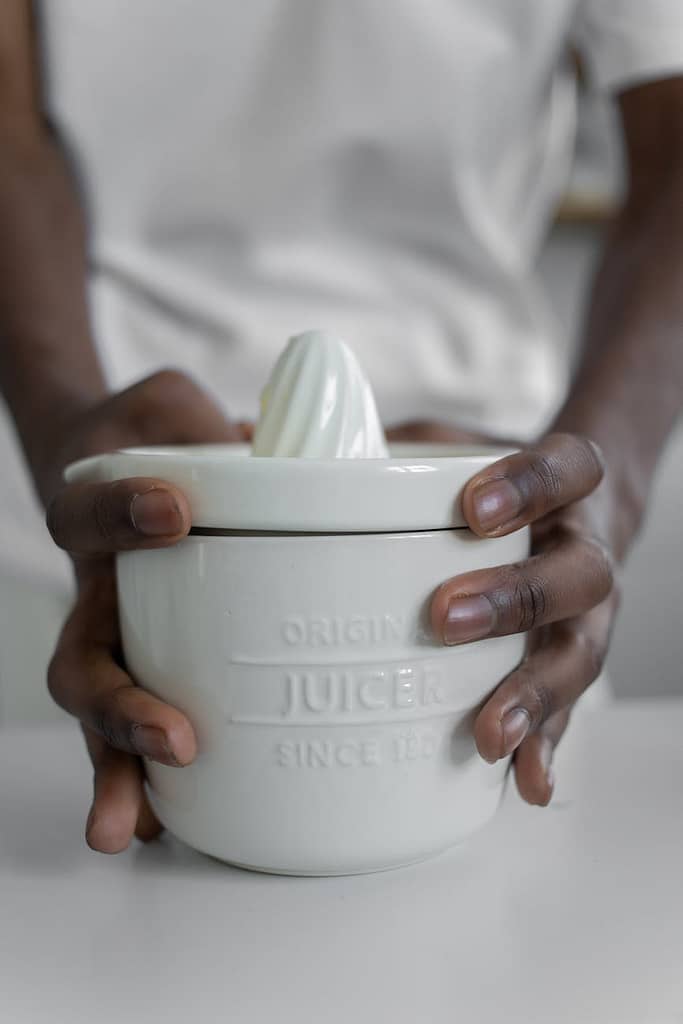 close up photo of person holding juicer